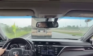 Police escort vehicle blocked by tractor-trailer for nearly 3 km