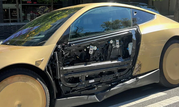 Tesla's plastic car door stripped bare after minor collision