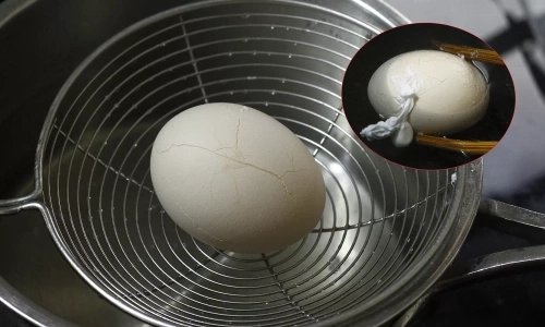 Why do eggs crack when boiled?