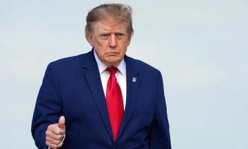 US president signs executive order to waive new sanctions on Russia
