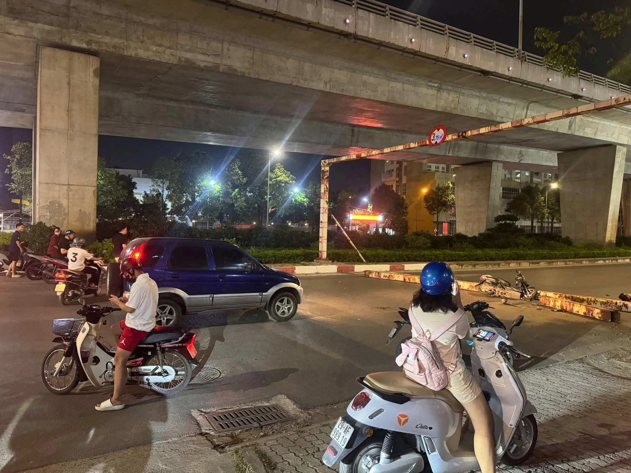Height restriction bar falls on motorcyclist